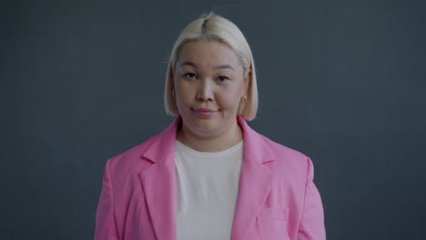 woman in a pink jacket, rejecting