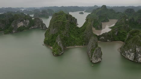 amazing rock monuments rising from the sea. ha long bay in vientiane from a drone