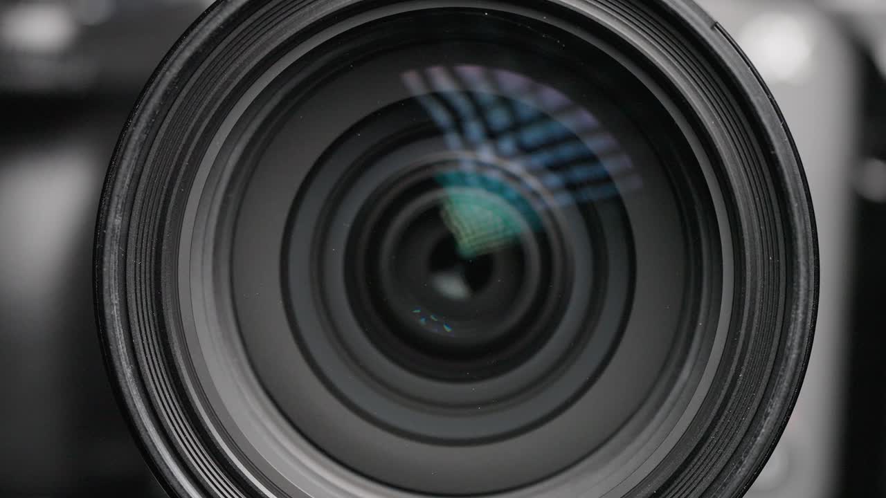 Macro shot capturing the lens elements shifting within the Sony FX3, emphasizing the camera's advanced optical design