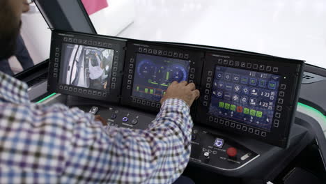 driver operating a modern tram's control panel