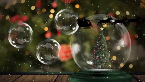 Animation-of-santa-claus-in-sleigh-with-reindeer-moving-over-snow-globe-with-christmas-tree