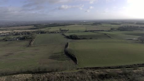 idyllic british farming meadows countryside fields aerial view slow aerial shot