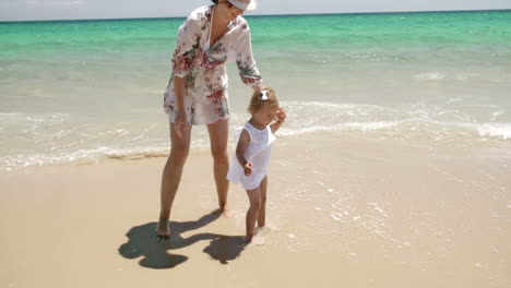 Young-Little-Girl-With-Her-Mum-on-The-Beach