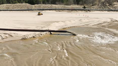 Rising-above-the-sand-spewing-dredge-pipe