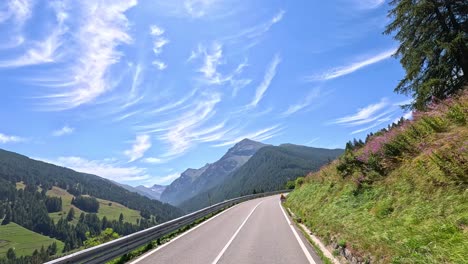 a winding road through picturesque mountain scenery