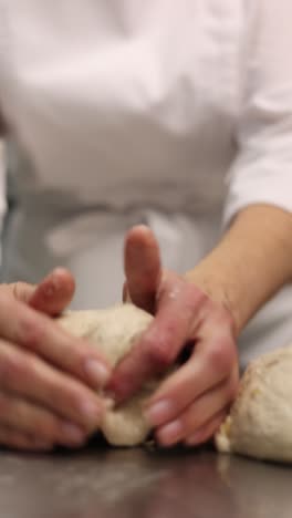 chef kneading dough