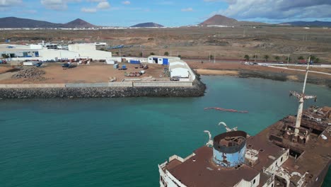 nice aerial view flight environmental disaster oil shipwreck on beach sandbank lanzarote canary islands, sunny day spain 2023