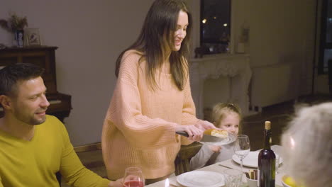 Mother-Cutting-Her-Daughter-A-Piece-Of-Apple-Pie