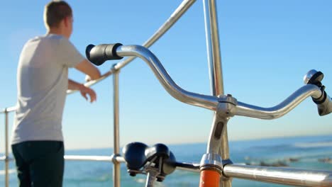 side view of man standing near railings 4k