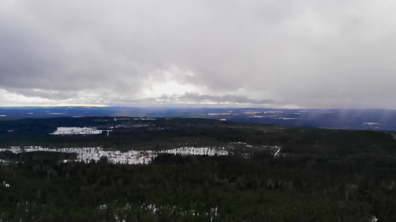 Drone shot of a snowy landscape in Sweden.