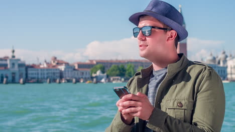 man in venice using his phone