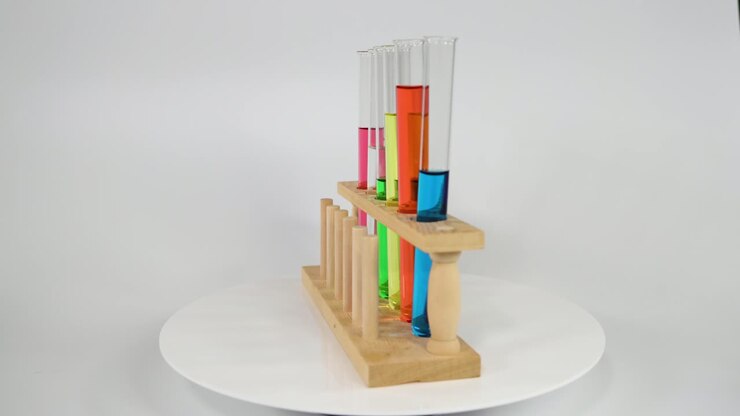 Test tubes with colored liquids in a rack