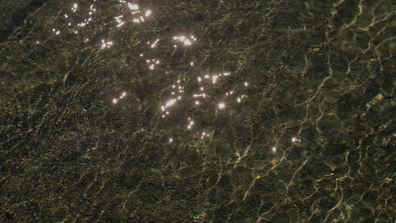 Peaceful morning in Geneva with the iconic Jet d’Eau rising from the lake, calm waters reflecting the clear sky, and the city slowly coming to life in the morning light.