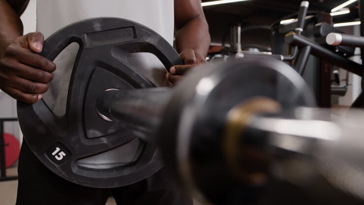 Man Lifting Weights in Gym