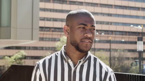 front view of thoughtful african american man talking on street