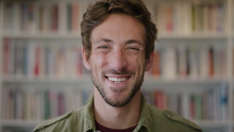 close-up-portrait-attractive-young-man-laughing-enjoying-successful-lifestyle-achievement-cheerful-caucasian-male-in-library-bookshelf-background