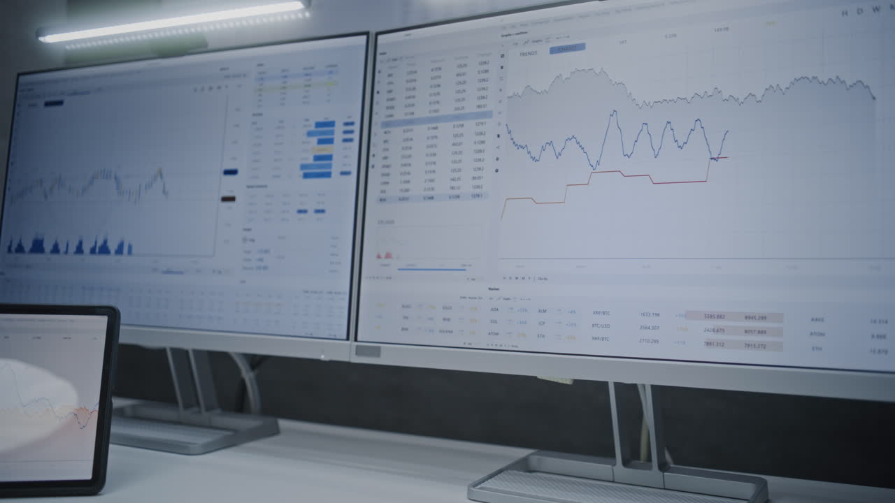 Financial Analyst Typing on Keyboard, Monitoring Real-Time Stocks and Exchange Market Charts on Computer with Multi-Monitor Workstation. African American Businessman Working in Office. Close Up Shot.