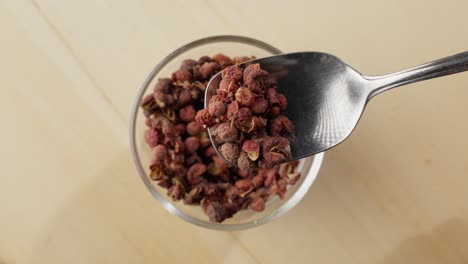 Slow motion capture of a falling Sichuan red pepper