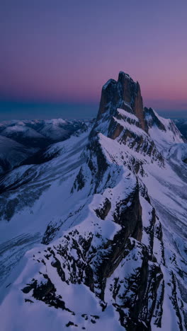majestic snow-covered mountain peak at sunset