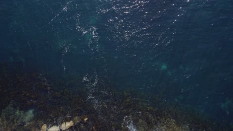 Flying-Above-Granite-Boulders-In-The-Coastal-Town-Of-Binalong-Bay-In-Tasmania