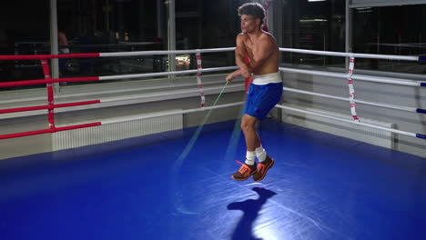 man jumping rope in boxing ring