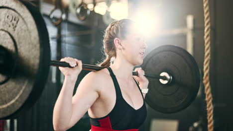 Woman-at-gym,-weight-lifting