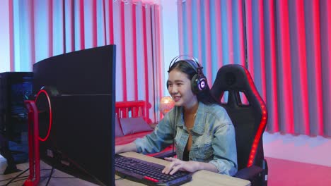 happy woman gaming at night