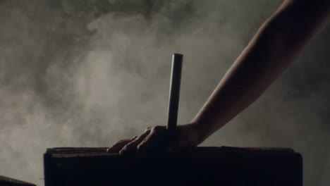 hammer hitting a big nail in a dramatic misty ambience