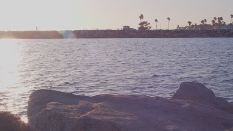 bright sunset over a long beach canal