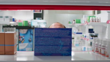 POV-of-employee-putting-supplements-boxes-on-display