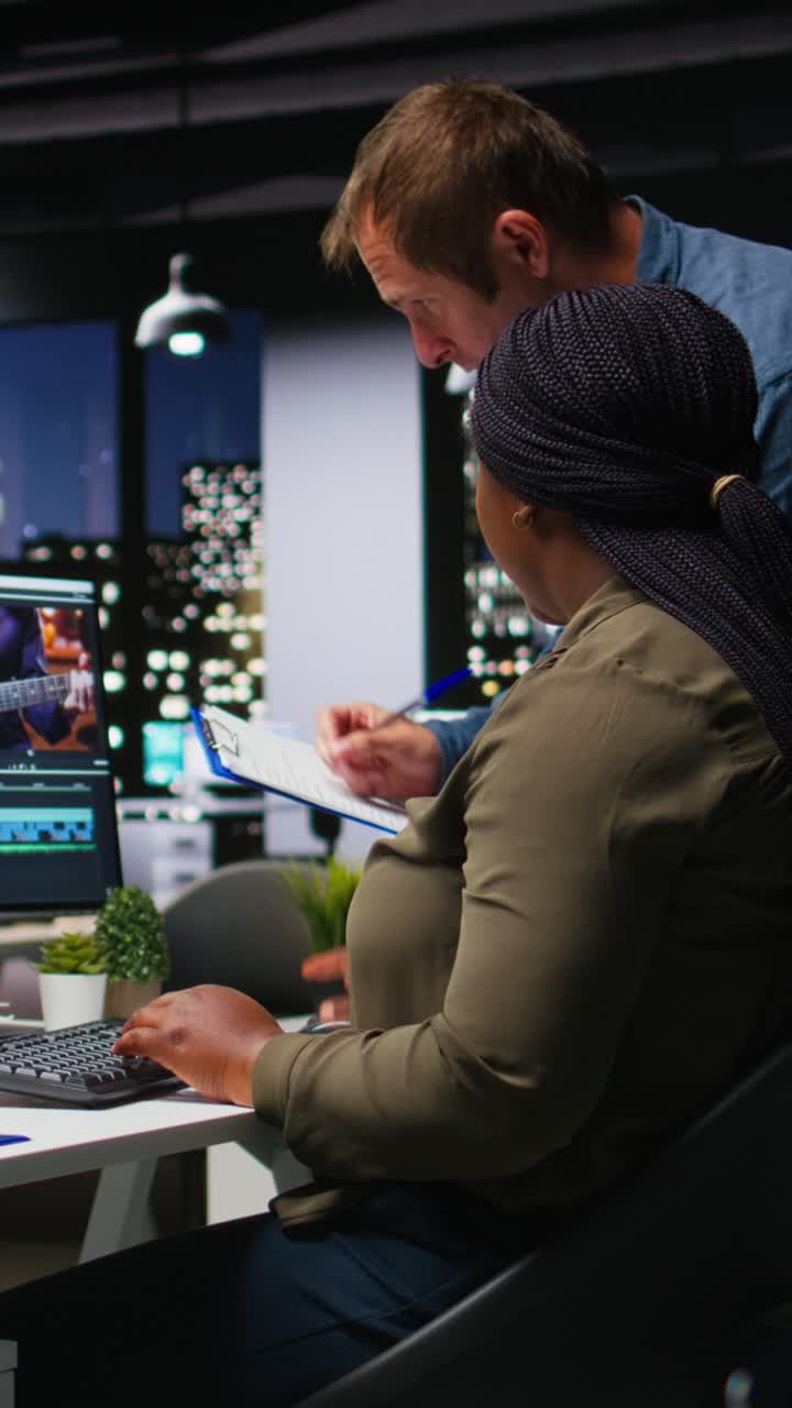 Vertical Video Man and woman filmmakers editing video shoot in post production