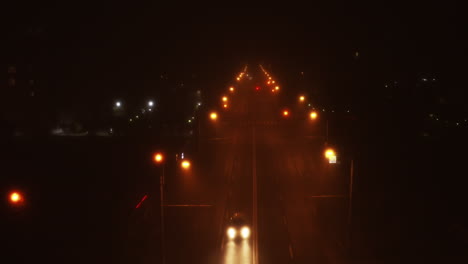 Symmetrical-Foggy-aerial-drone-footage-of-Cluj-Napoca-city-at-night