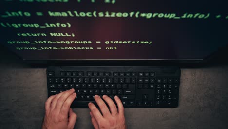 person coding at computer