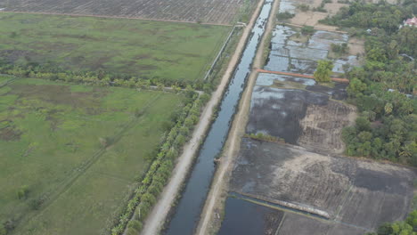 Beautiful-fly-reveal-of-rice-field-and-irrigation-system-in-Battambang-province