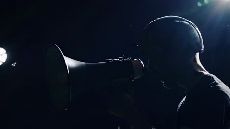 man with helmet and megaphone