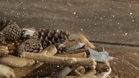 falling snow with christmas decorations on wood