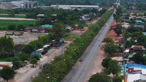 aerial view of a rural road and village in thailand