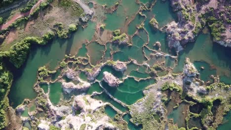 aerial top down view blue water lake in frog hill, guar petai, penang.