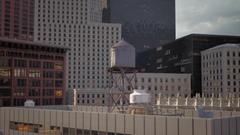 water tower on a rooftop in a city