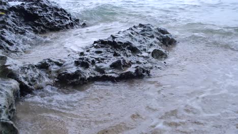 Foamy-Waves-Swashing-On-Rocky-Sea-Shore-In-The-Town-Of-Aloguinsan-In-Cebu,-Philippines