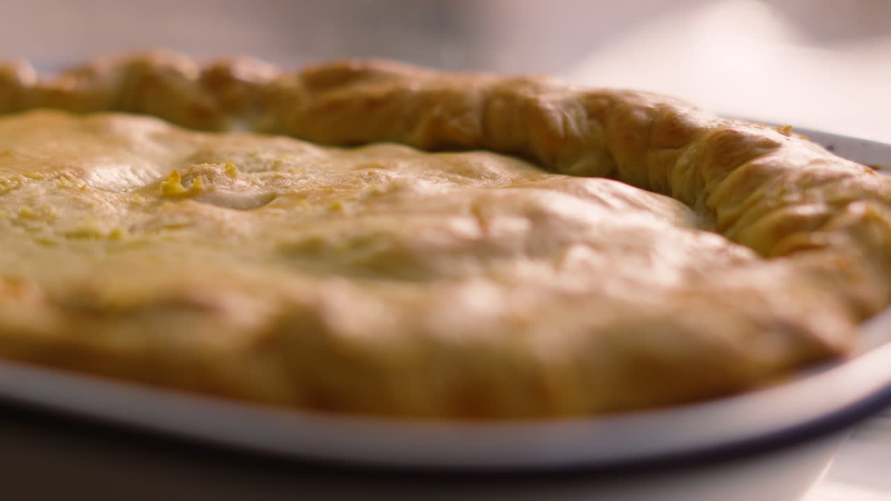 Close Up View of Homemade Deep Filled Shortcrust Chicken Mushroom Vegetable Pie with Golden Rustic Beautiful Pastry. Comforting British Tasty Delicious Food.