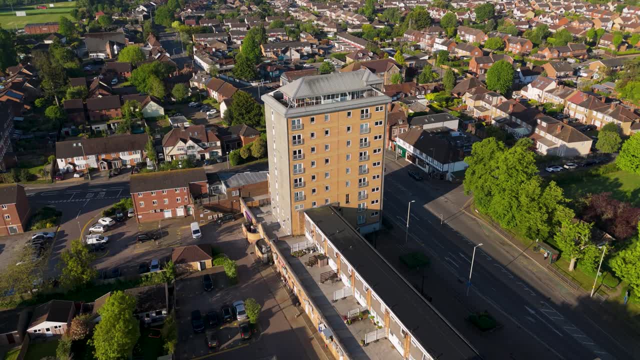 Drone orbit over Broxbourne town centre, Hertfordshire UK with park and tower block