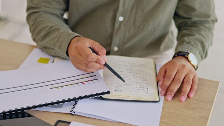 Writing, notebook and research with hands of man