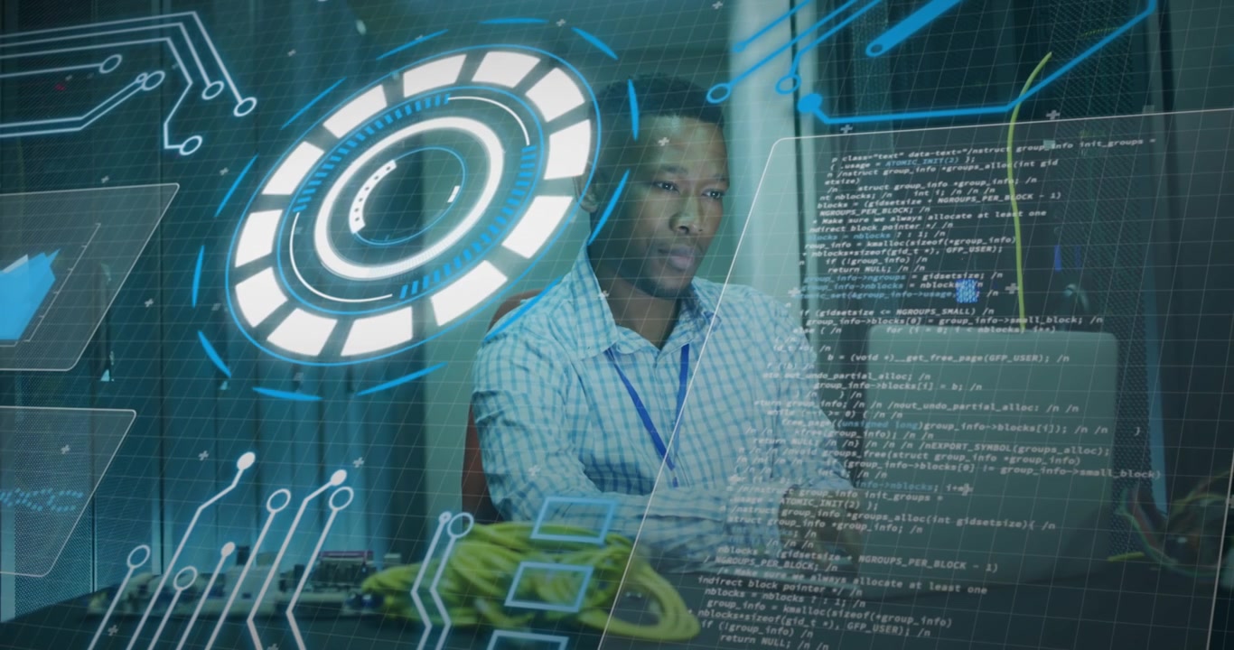 Animation of loading circles, computer language, african american man using laptop in server room