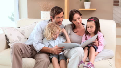 Joyful-family-reading-a-book