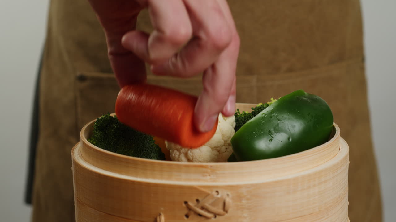 Chef Steaming Vegetables in Bamboo Steamer