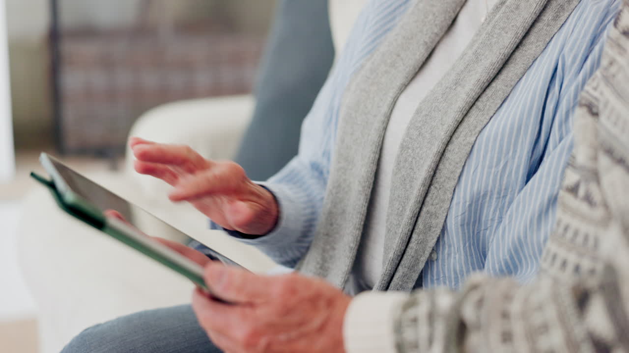 Hands, senior and tablet on sofa for search