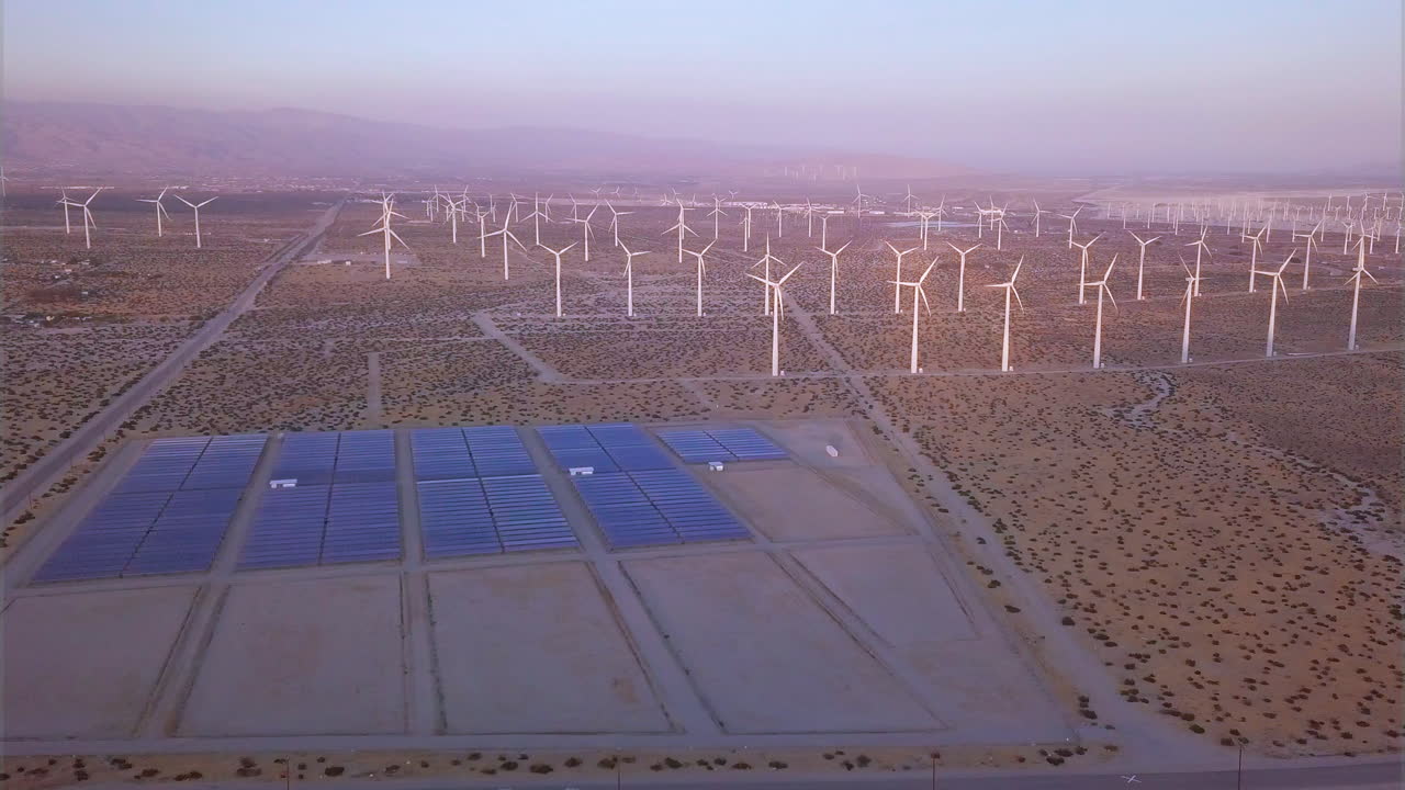 Aerial view of a wind farm featuring wind turbines and solar panels in Southern California - Energy Production