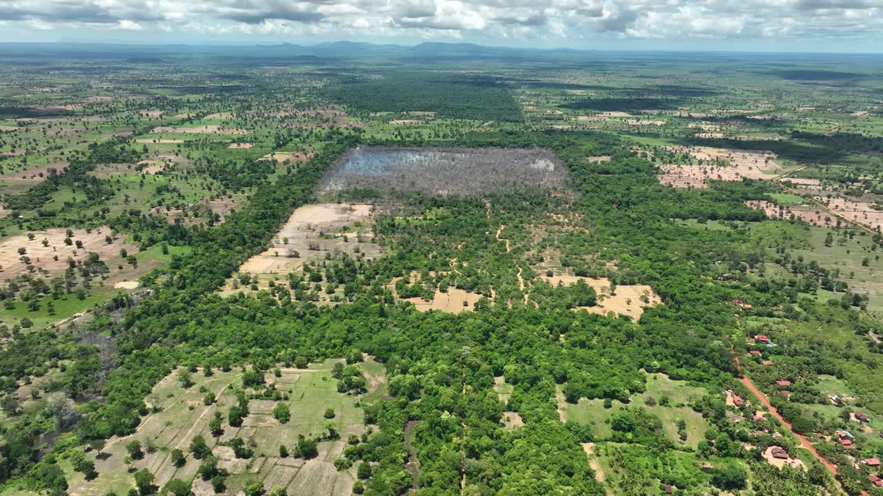 Aerial view, lush Cambodian farmland near historic ancient temple site