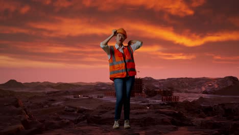 cuerpo lleno de ingeniera asiática con casco de seguridad gritando gol y bailando celebrando en el sitio de construcción, maquinaria de minería